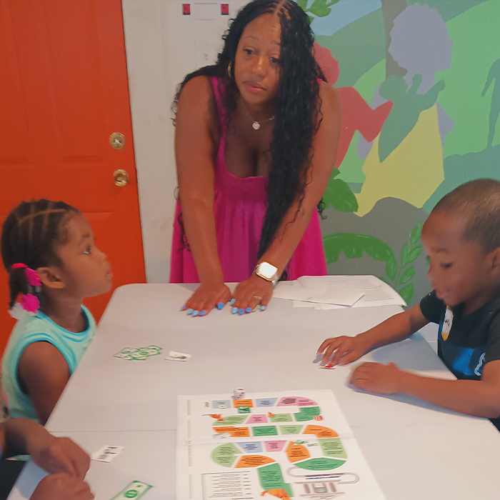 FMB Artina Packnett teaching financial wellness to kids in the community.