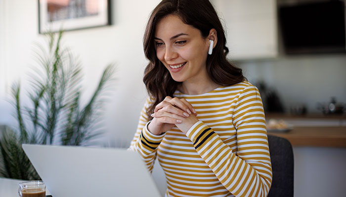 Woman watch training videos at work.